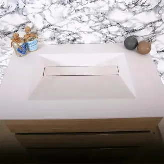 ENCIMERA SOLID SURFACE A MEDIDA MONOPOLI CON FALDON BAALNEO